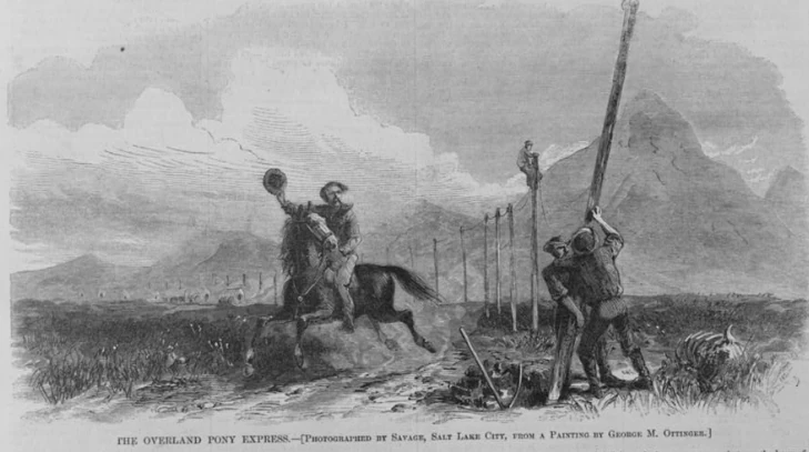 Man on horse riding past and having hat at men putting up a telegraph pole